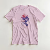 Pink t-shirt with a colorful graphic design on a light gray background