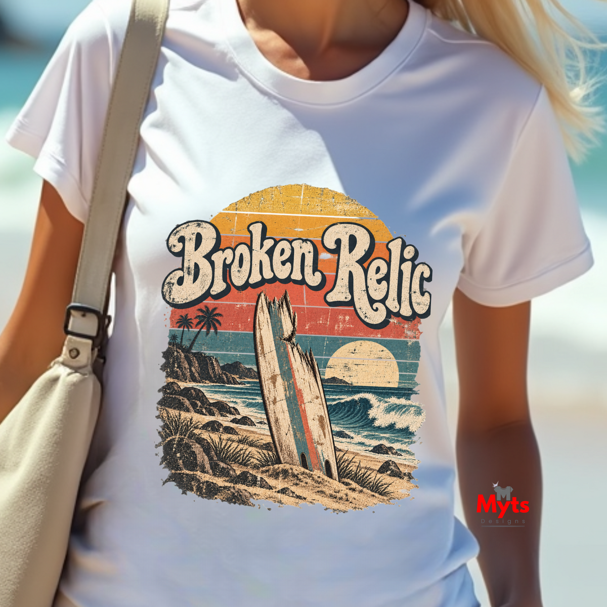 Woman wearing white Broken Relic vintage surf graphic T-shirt at the beach