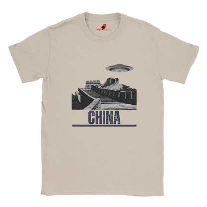 “Neutral T-shirt with a vintage black-and-white Great Wall of China illustration and a UFO hovering above it, labeled ‘CHINA,’ designed by MytsDesigns.com”


