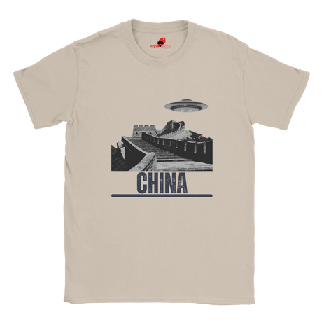 “Neutral T-shirt with a vintage black-and-white Great Wall of China illustration and a UFO hovering above it, labeled ‘CHINA,’ designed by MytsDesigns.com”

