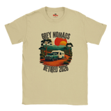 A Natural crewneck t-shirt featuring a retro-style graphic of a green camper trailer and truck on a dirt road with a sunset, accompanied by the text 'GREY NOMADS RETIRED 2026'. The brand 'Myths' is visible on the inner neck label.