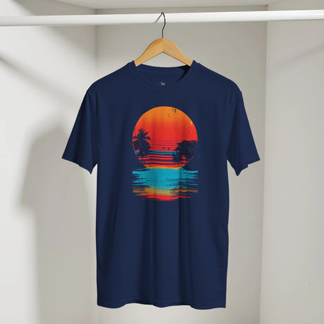 Navy blue t-shirt with a colorful sunset graphic on a wooden hanger against a white wall.