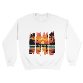 A white unisex sweatshirt featuring a vibrant tropical sunset design with silhouettes of surfers walking along a beach. The graphic includes palm trees, an orange and pink sky, and artistic brushstroke edges, creating a modern coastal vibe. Ideal for beach lovers, surfers, and casual fashion fans.

