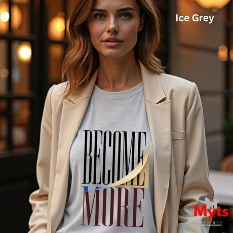 A woman wearing a light beige blazer over an ice grey graphic t-shirt with the text 'BECOME MORE' in black, gold, and burgundy. The image has 'Ice Grey' text in the top right and a 'Myts' brand logo in the bottom right.