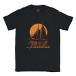 Black t-shirt with a sailboat and sunset design on a white background