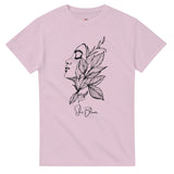 Pink t-shirt with a black floral and face design on a white background
