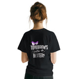 Person wearing a black t-shirt with text and a graphic on the back