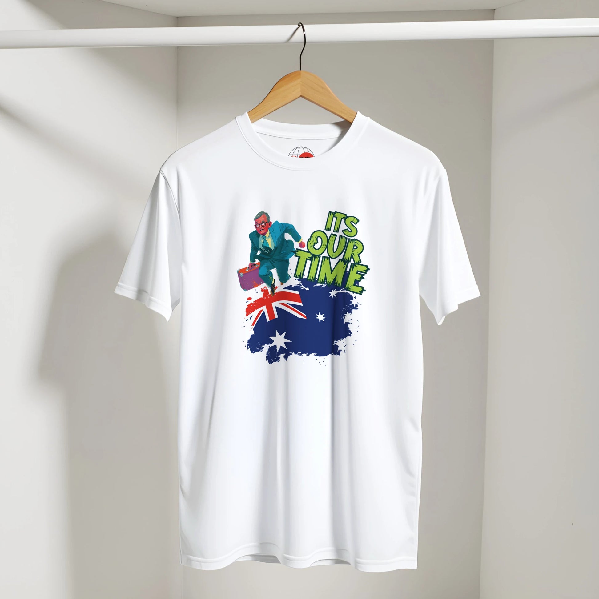 White t-shirt with a graphic design featuring an Australian flag and text on a hanger against a plain background.