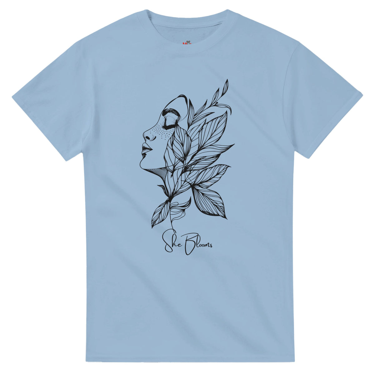 Light blue t-shirt with black artistic design of a face and leaves on a white background