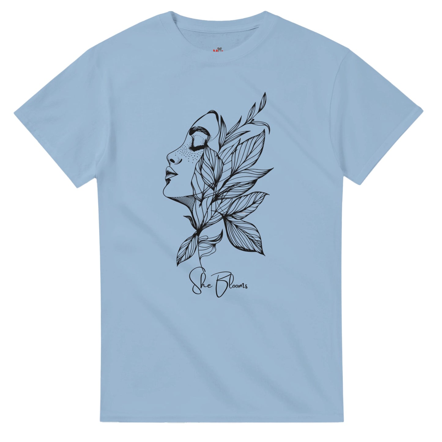 Light blue t-shirt with black artistic design of a face and leaves on a white background