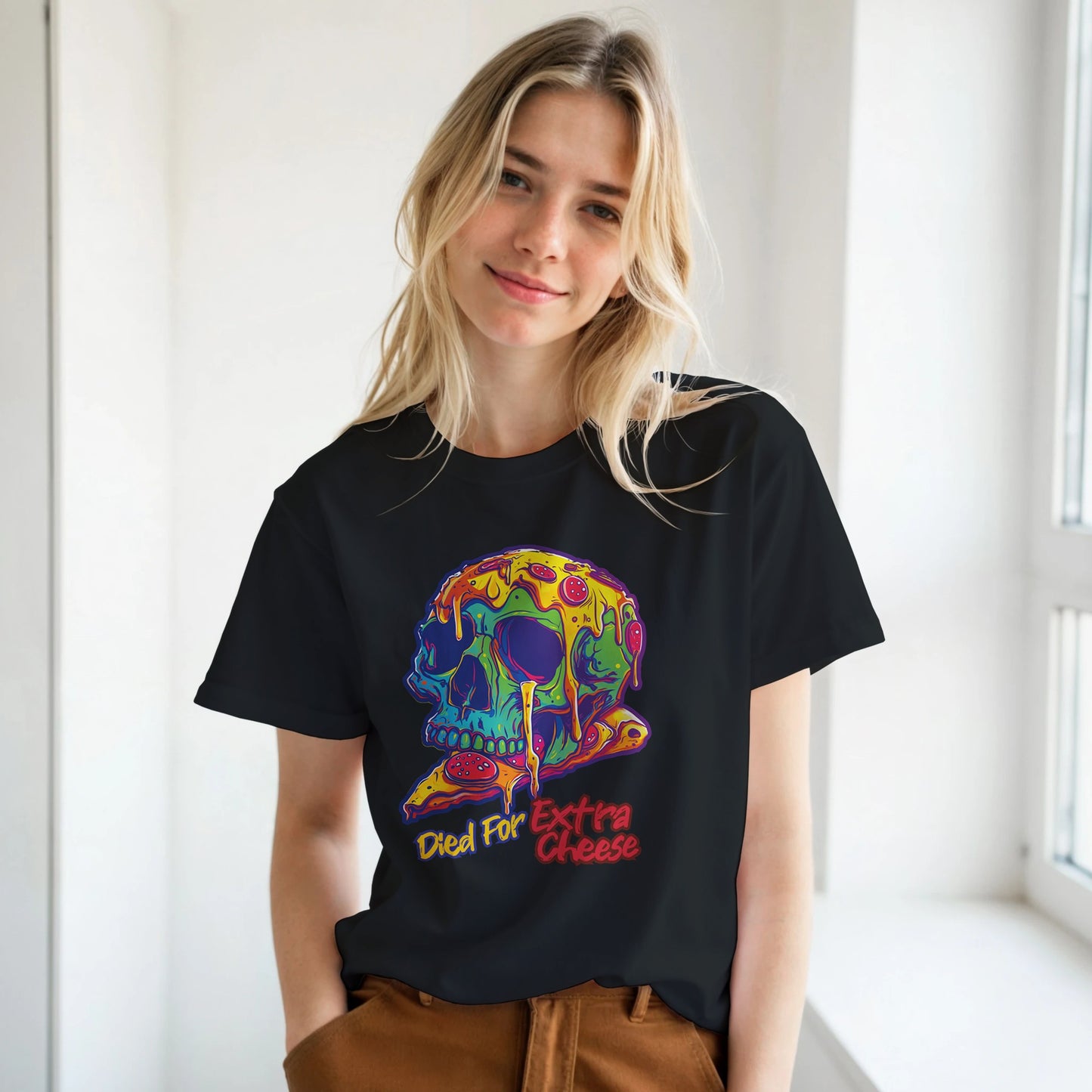 Person wearing a black t-shirt with a colorful skull design and text.