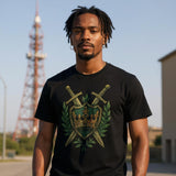 Man wearing a black T-shirt with an embroidered-style design of a green shield featuring a gold crown, flanked by crossed swords and laurel leaves—regal, medieval-inspired graphic centered on the chest.