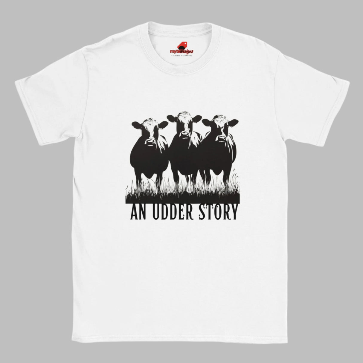 Front view of white cotton T-shirt featuring illustrated cows and text “An Udder Story” – humorous farm-themed graphic tee