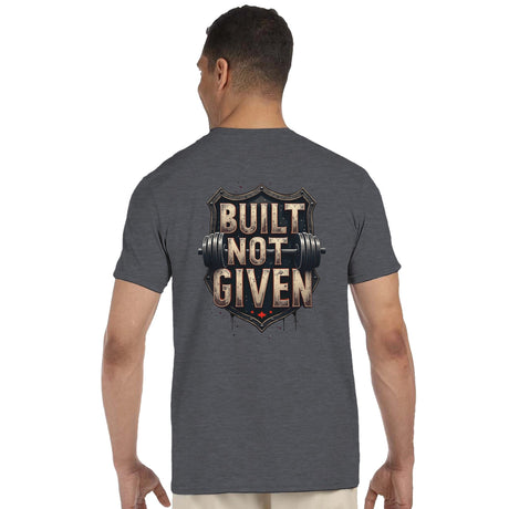 Person wearing a gray t-shirt with 'Built Not Given' design on the back