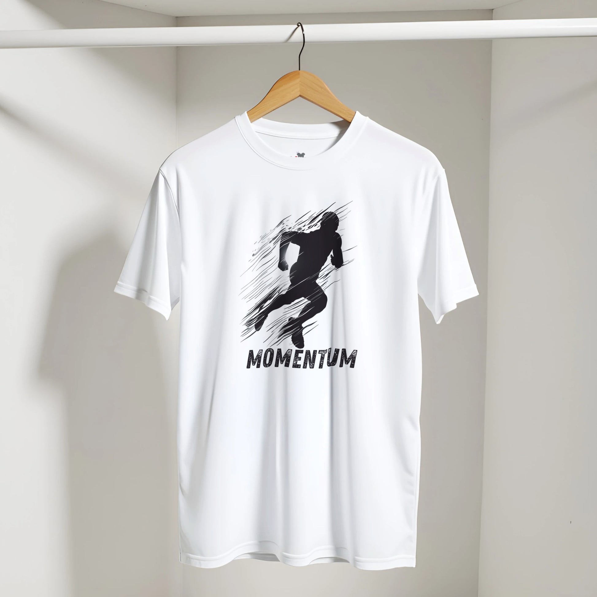 White t-shirt with black graphic and 'MOMENTUM' text on a hanger against a white wall.