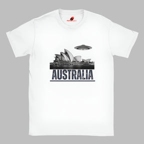Front view of a white soft casual tee showing the Sydney Opera House sails with a sleek spaceship graphic orbiting overhead, printed on ultra-soft Gildan 64000 cotton.