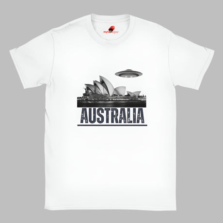 Front view of a white soft casual tee showing the Sydney Opera House sails with a sleek spaceship graphic orbiting overhead, printed on ultra-soft Gildan 64000 cotton.