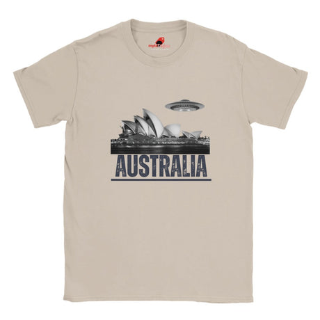 Front view of a sand colored soft casual tee showing the Sydney Opera House sails with a sleek spaceship graphic orbiting overhead, printed on ultra-soft Gildan 64000 cotton.
