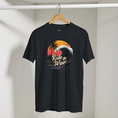 Black t-shirt with 'Ride the Wave' design on a hanger against a white wall