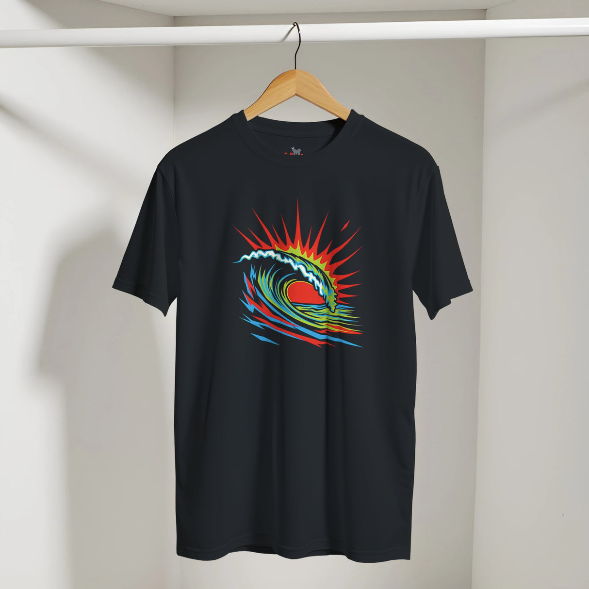Black t-shirt with a colorful wave design on a hanger against a white wall.
