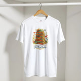 White t-shirt with book-themed design on a hanger against a plain background