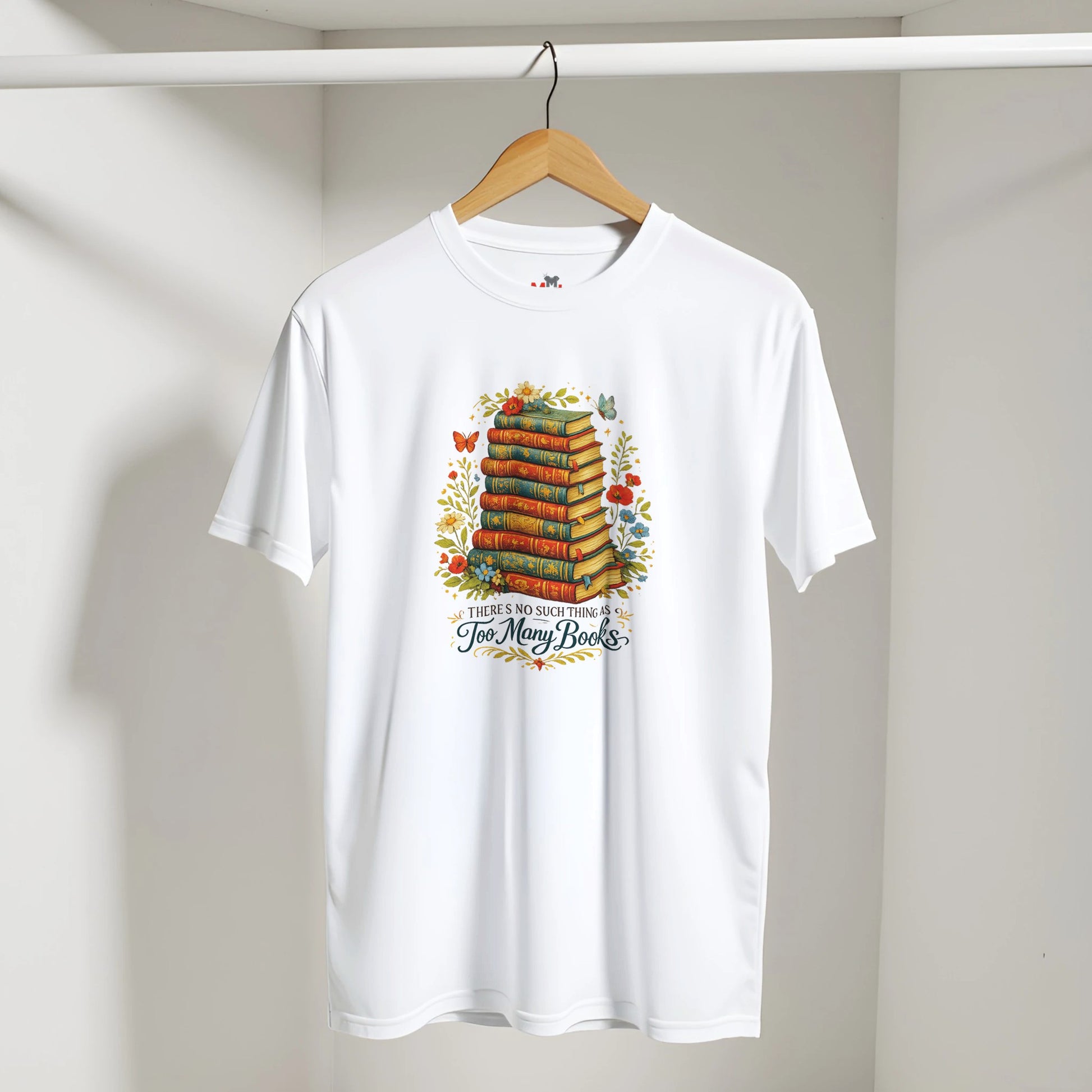 White t-shirt with book-themed design on a hanger against a plain background