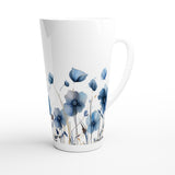 A tall white ceramic latte mug featuring a watercolor-style print of blue poppy flowers and thin brown stems, shown on a clean white background.