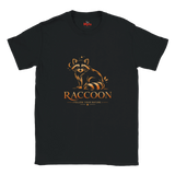 A black short-sleeve crewneck t-shirt featuring a stylized orange raccoon graphic above the word 'RACCOON' and the phrase 'FOLLOW YOUR NATURE'. The inner neck label shows the brand 'Myths'.
