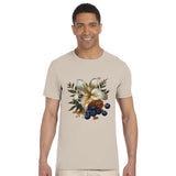 Man wearing a beige t-shirt with a floral and berry design on a white background