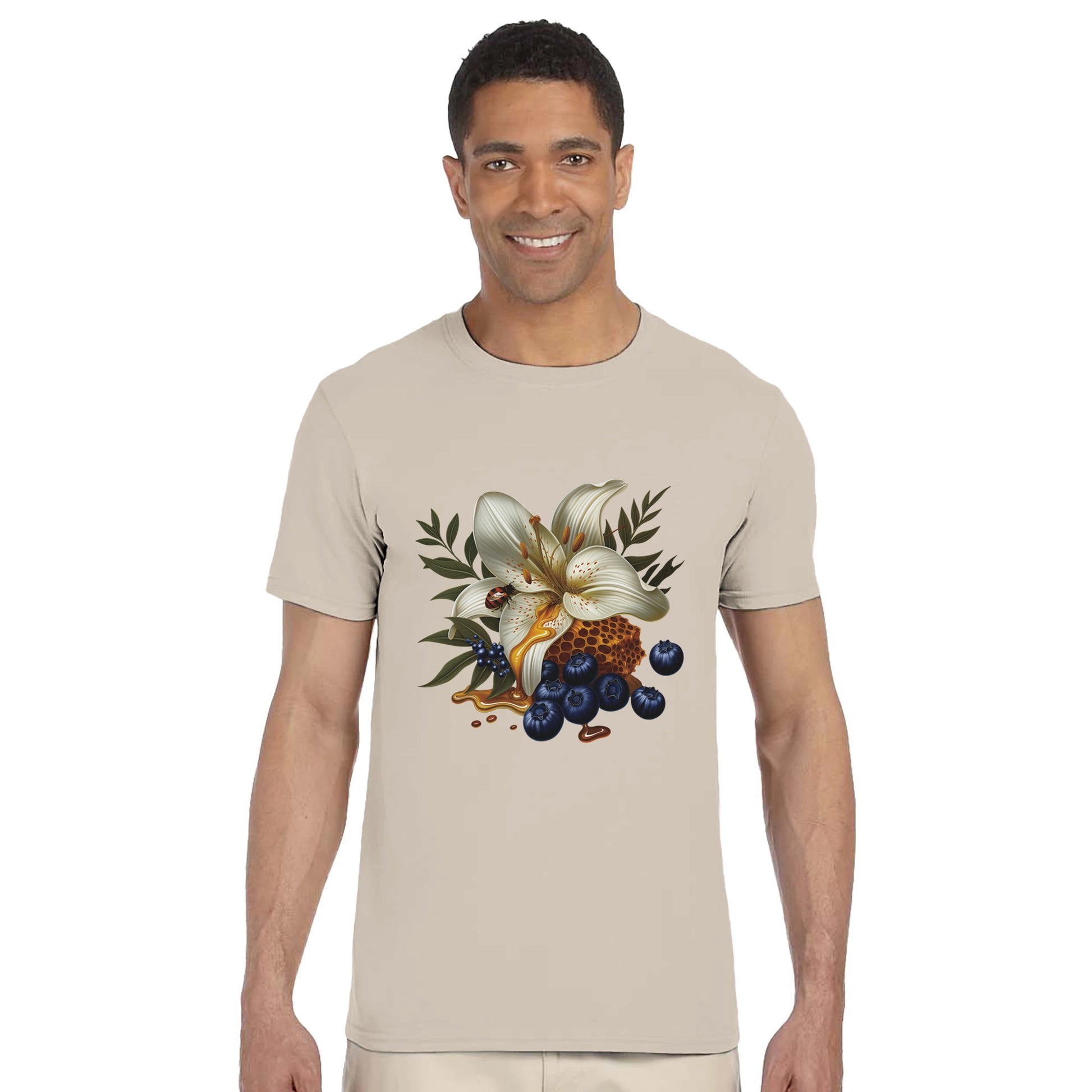 Man wearing a beige t-shirt with a floral and berry design on a white background