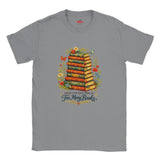Gray t-shirt with a graphic of books and flowers on a white background