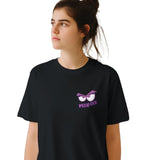 Person wearing a black t-shirt with a graphic design and text on a white background