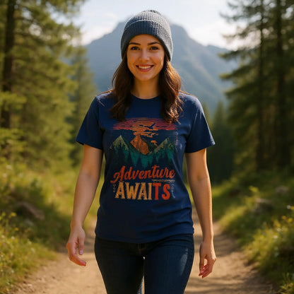 Woman wearing an 'Adventure Awaits' t-shirt in a forest setting
