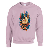 A light pink crewneck sweatshirt featuring a colorful graphic print of a nautilus shell surrounded by seashells, starfish, and coral on the front, displayed on a clean white background.