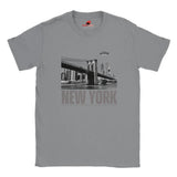 Sports Grey soft casual tee showing the New York City skyline with a stylized spaceship graphic soaring above, printed on ultra-soft Gildan 64000 cotton.