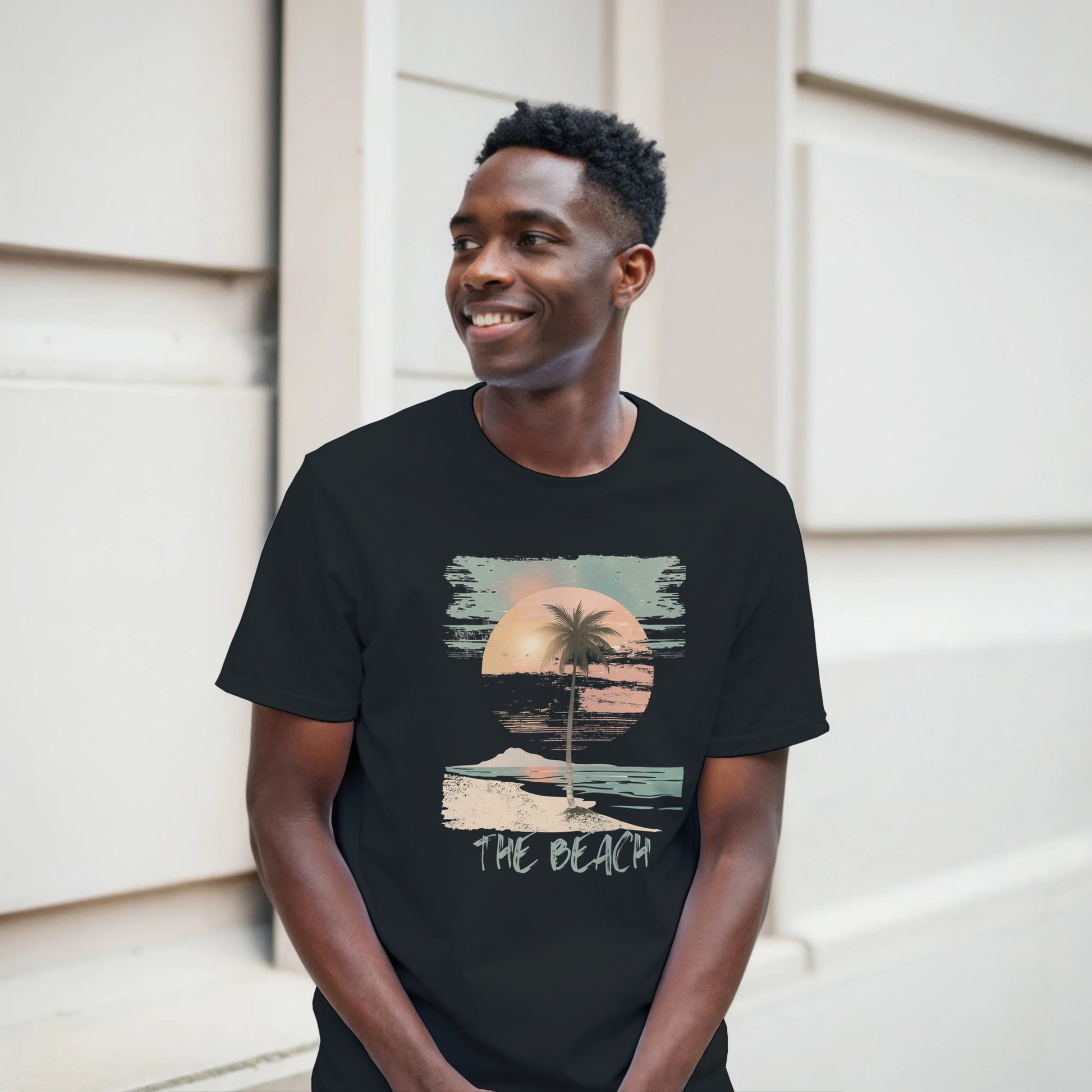 Front view of vintage beach T-shirt featuring palm trees and retro sunset graphic on black cotton tee