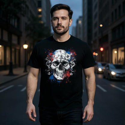 Man wearing a black t-shirt with a skull design on a city street
