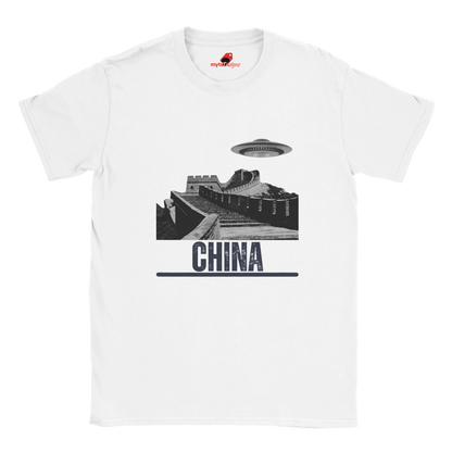 “White T-shirt with a vintage black-and-white Great Wall of China illustration and a UFO hovering above it, labeled ‘CHINA,’ designed by MytsDesigns.com”

