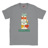A flat lay grey T-shirt featuring a colorful graphic of four stacked cartoon puppies in teal, orange, cream, and yellow shades with the words “Puppy Love” in playful green text below

