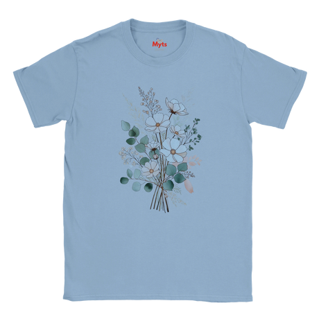 A light blue short-sleeve crewneck t-shirt featuring a central graphic of a watercolor-style floral bouquet with green, white, and peach blossoms. The brand name 'Myts' is printed in red on the inside neck label.
