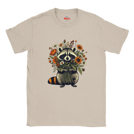 A Natural crewneck T-shirt featuring a graphic of a raccoon holding a bouquet of orange, yellow, and white wildflowers. The brand name 'Myts' is printed inside the collar.