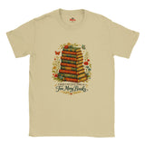 Natural t-shirt with a graphic of stacked books and floral elements, featuring the text 'There's no such thing as too many books'.