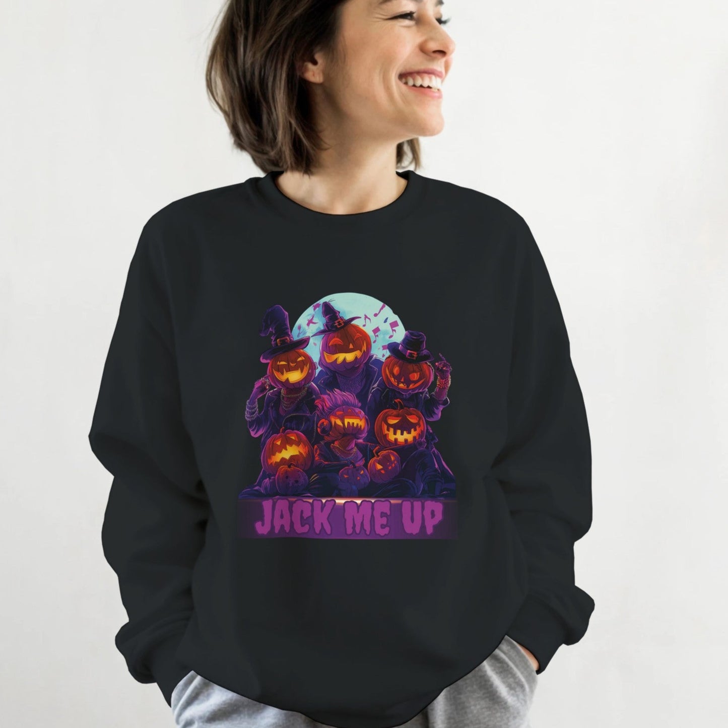 Person wearing a black sweatshirt with Halloween-themed design and text.