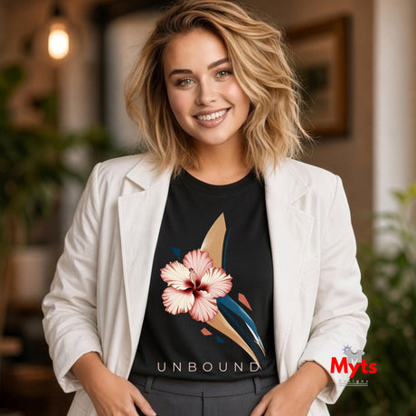 Woman styling a black UNBOUND hibiscus floral T-shirt with a white blazer and grey tailored trousers.