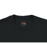 Black t-shirt with a logo on the collar against a white background