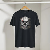 Black t-shirt with a skull design on a hanger against a plain background