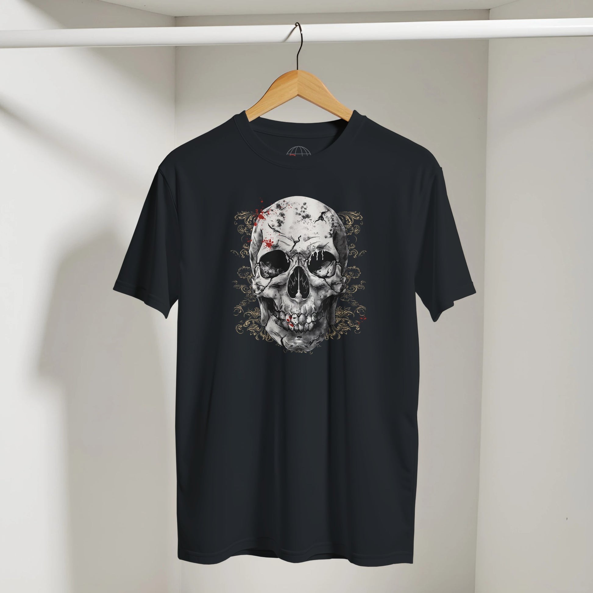 Black t-shirt with a skull design on a hanger against a plain background