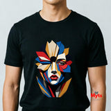Man wearing a black abstract geometric face T-shirt featuring a colourful fragmented portrait design in red, blue, gold, cream and black.