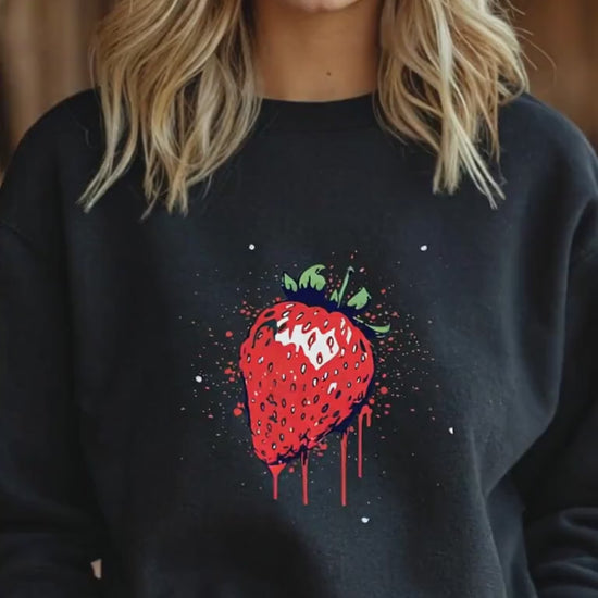 girl walking wearing black strawberry sweatshirt