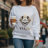 Person wearing a white sweatshirt with a fox design and 'VIXEN' text, holding a coffee cup.